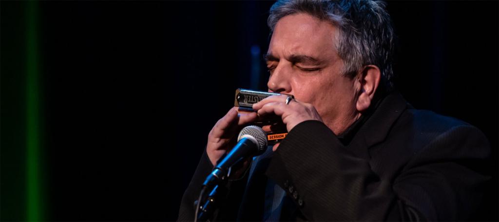 Daniel "Catfish" Russ playing the harmonica