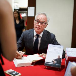 "60 Minutes" correspondent signs a copy of his new book, "Truth Worth Telling: A Reporter's Search for Meaning in the Stories of Our Times."