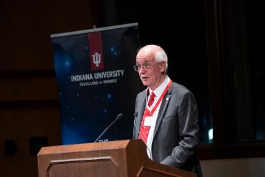 Jim Bright speaking at a podium