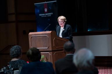 Sandra Moberly at a podium