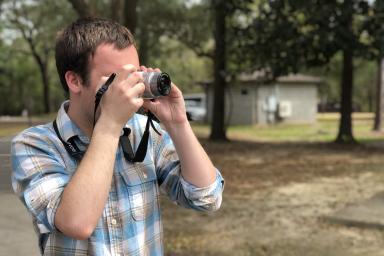 Spencer Bowman taking a photograph