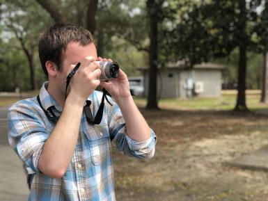 Spencer Bowman taking a photograph