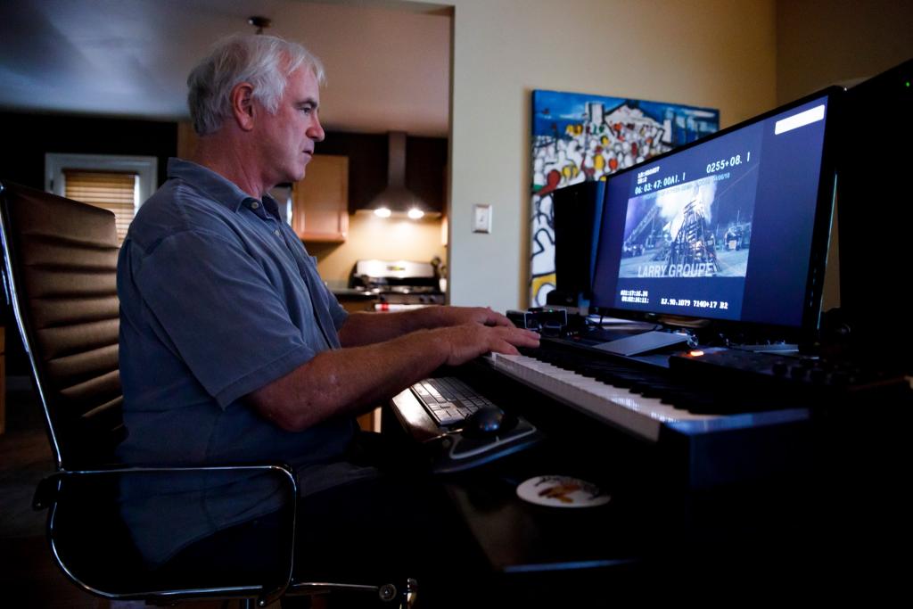 Larry Groupé working on a computer