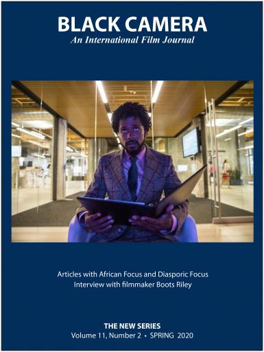 The front cover of Black Camera: An International Film Journal. It features a photo of Boots Riley looking at a binder. Text says: Articles with African Focus and Diasporic Focus. Interview with filmmaker Boots Riley. The New Series. Volume 11, Number 2. Spring 2020.