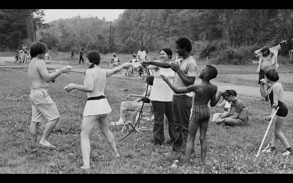 Children playing outside in swimsuits