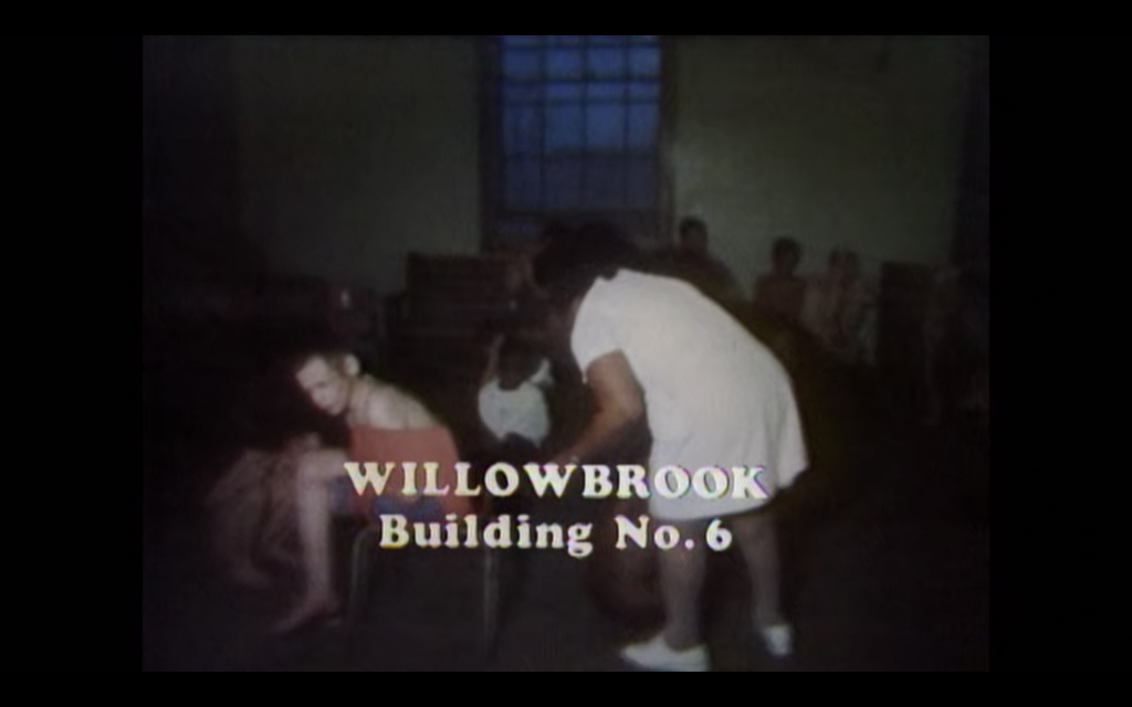 Children tied to chairs. Text says: Willowbrook Building No. 6