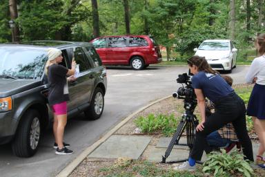 Students filming a scene on campus