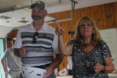 JR Ross and Judy McKenzie draw raffle tickets out of a bowl