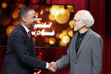 Stephen Lucas and Walter Gantz shake hands
