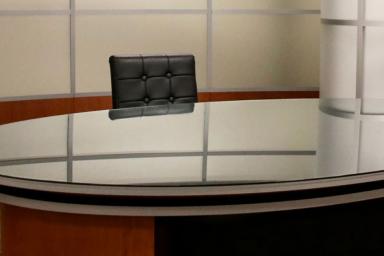 A news desk in a broadcast studio
