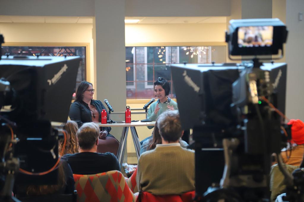 Afghan journalist Fatema Hosseini (right) speaks to students, facutly and community members in a Q&A moderated by professor of practice Kelley French.