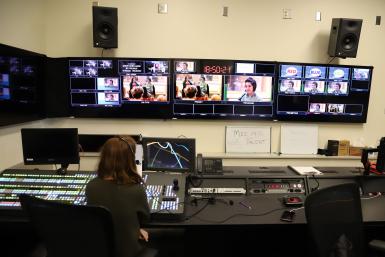 Sophomore Emma Watson supervises the Zoom broadcast of the talk from the Ed Spray Control Room. 