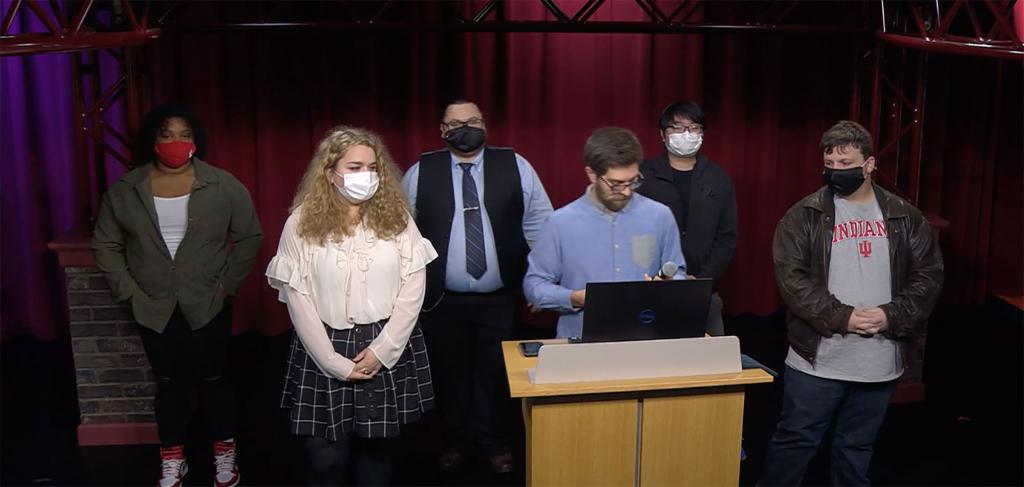 Six students stand at a podium in the Beckley Studio