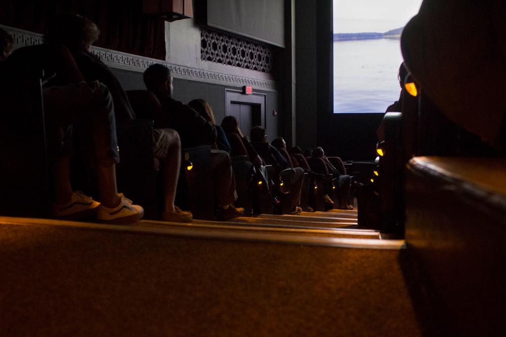 A crowd at the IU Cinema watching a film