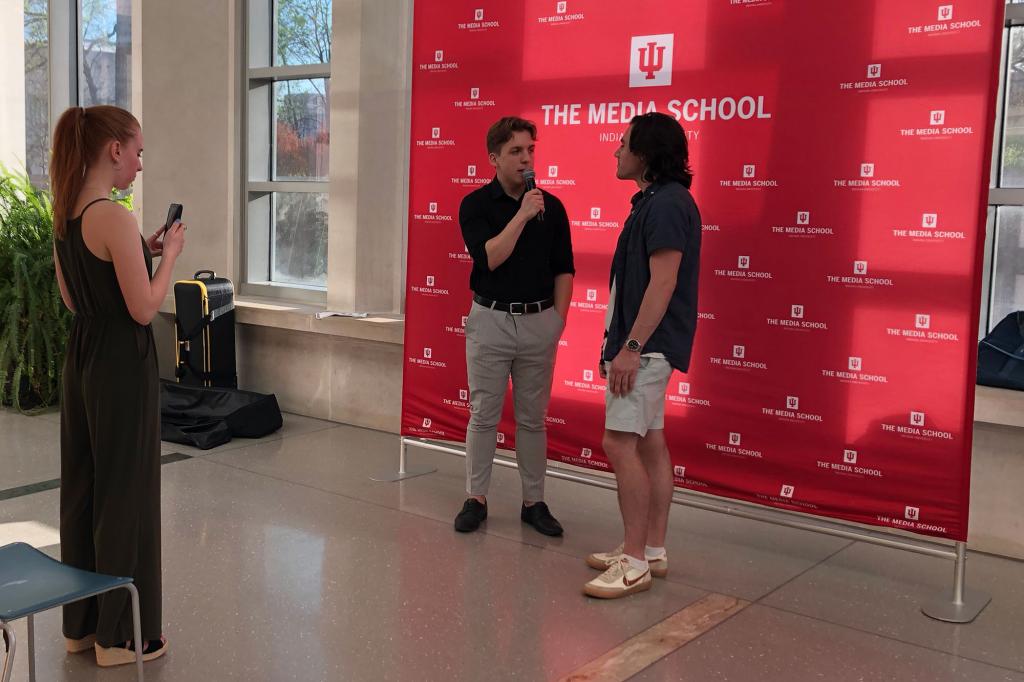 Freshman Joey Still, host of IUSTV's "Behind the Curtain," interviews a student filmmaker before the awards ceremony.