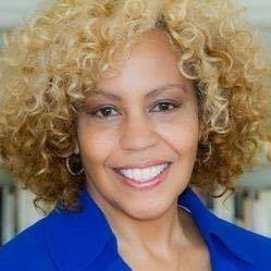 Renee Ferguson headshot. Black woman wearing blue shirt smiles