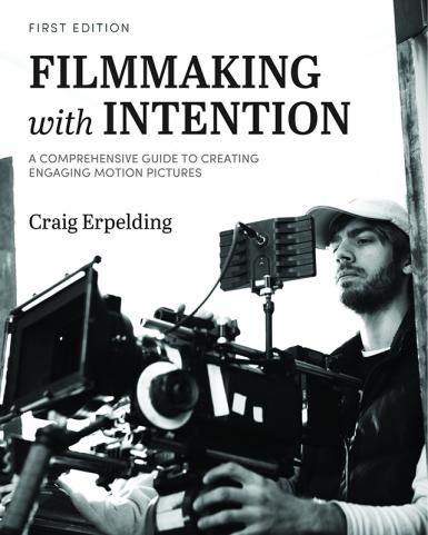 Man holding video camera sits below text reading "Filmmaking with Intention."