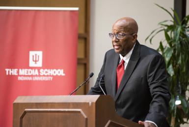 Vernon Williams speaks at a podium during the DAA ceremony.