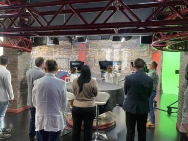 Group stands in Beckley Studio during tour of facility.