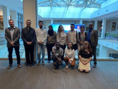 Group stands on the second floor of Franklin Hall in the commons.