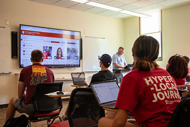 HSJI sportscasting students sitting in a classroom.