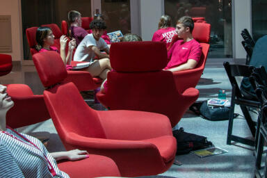 HSJI students sit in chairs in Franklin Hall Commons.