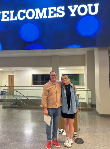 Two people stand next to one another in the Franklin Hall commons.