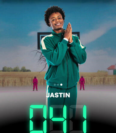 Person stands in front of an animate background with "Jastin" and the number "041" digitally displayed on the screen.