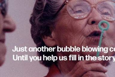 An ad featuring two elderly ladies. The one on the left is blowing bubbles. Text reads: 
