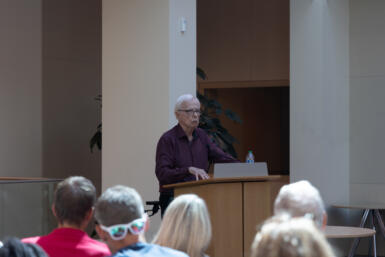 John Mileys speaks at the podium