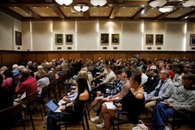 Wide shot of an audience seated in Presidents Hall.