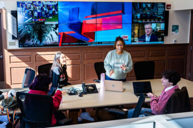 Students talking around a table in the Arnolt Center