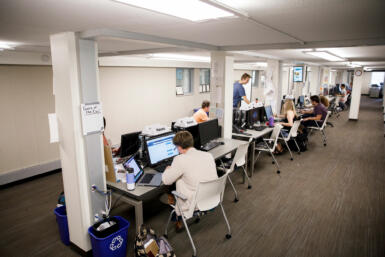 Indiana Daily Student staff members work in the newsroom.