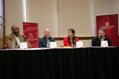 Mike Wells, Chris Buckle, Stephanie Kuzydym, and Joe Tone sit at a table.