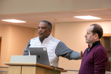 Mark Grant rests his hand on the shoulder of Ken Mack.