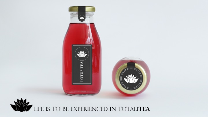 One glass bottle of tea stands upright with a label that reads 