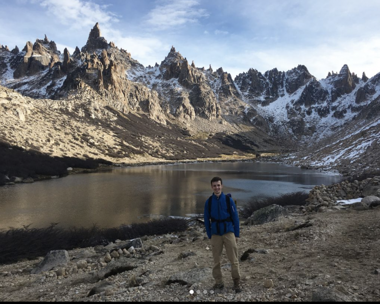 Fuller posing in front of mountains