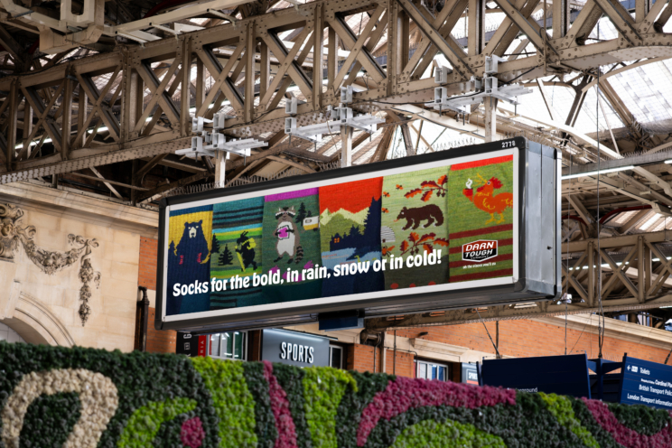 Out of home ad that shows all the different socks, with text that reads "socks for the bold, in rain, snow or in cold!"