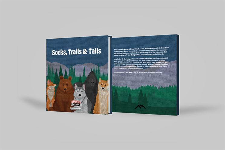 Children's book sponsored by darn tough that is titled "Socks, trails & Tails."